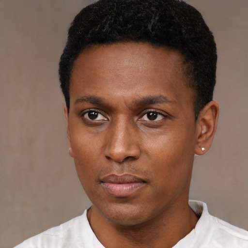 Neutral black young-adult male with short  black hair and brown eyes