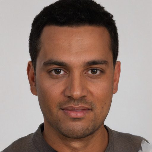 Neutral white young-adult male with short  black hair and brown eyes