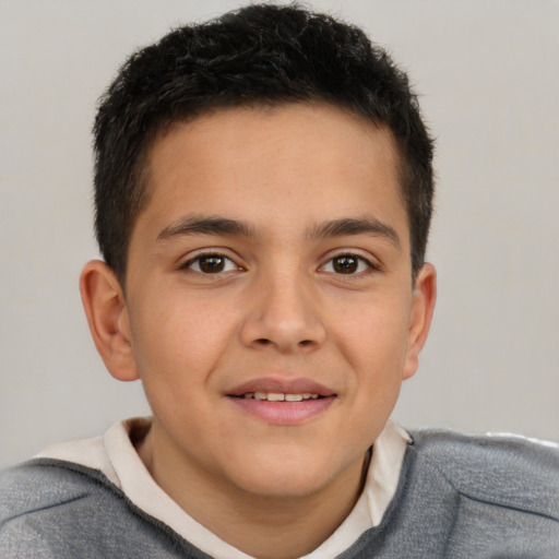 Joyful white child male with short  brown hair and brown eyes