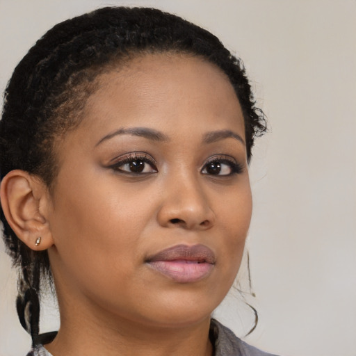 Neutral black young-adult female with medium  brown hair and brown eyes