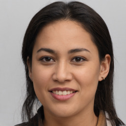 Joyful latino young-adult female with medium  brown hair and brown eyes