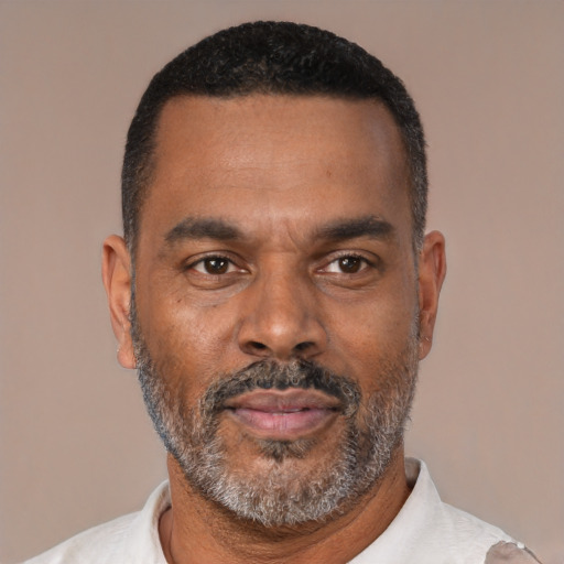 Neutral latino adult male with short  black hair and brown eyes