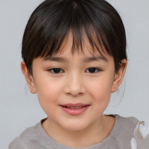 Joyful asian child female with medium  brown hair and brown eyes