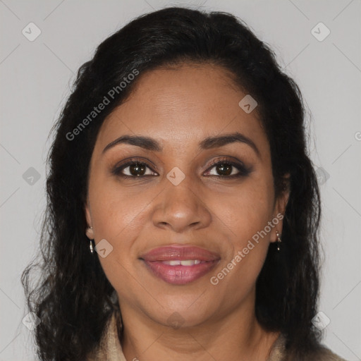 Joyful black young-adult female with long  brown hair and brown eyes