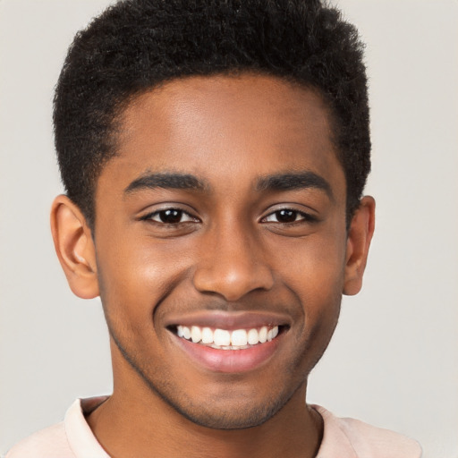 Joyful black young-adult male with short  brown hair and brown eyes