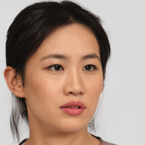 Neutral asian young-adult female with medium  brown hair and brown eyes