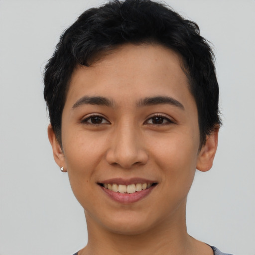Joyful asian young-adult female with short  black hair and brown eyes