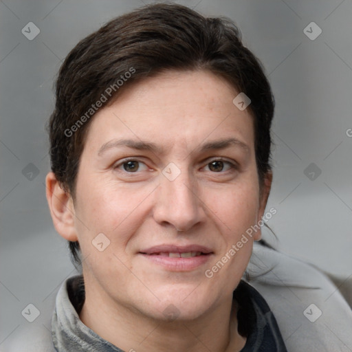 Joyful white adult female with short  brown hair and grey eyes