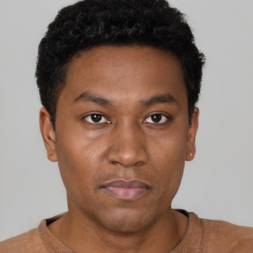 Neutral black young-adult male with short  brown hair and brown eyes