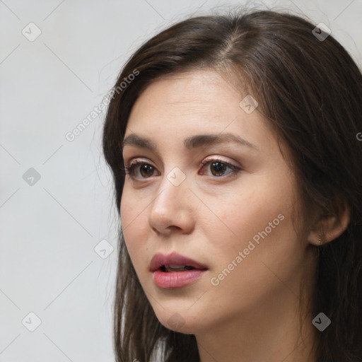 Neutral white young-adult female with long  brown hair and brown eyes