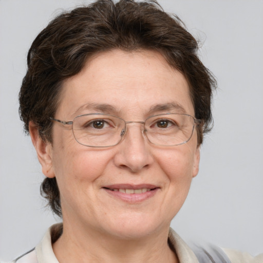 Joyful white middle-aged female with short  brown hair and grey eyes