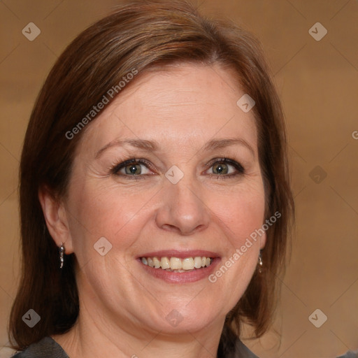 Joyful white adult female with medium  brown hair and blue eyes