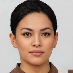 Joyful asian young-adult female with short  black hair and brown eyes