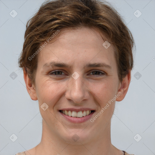 Joyful white young-adult female with short  brown hair and grey eyes