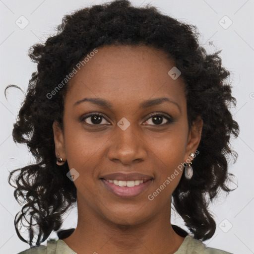 Joyful black young-adult female with long  brown hair and brown eyes