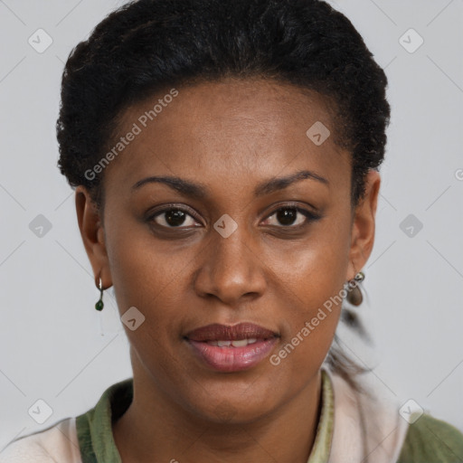 Joyful black young-adult female with short  brown hair and brown eyes