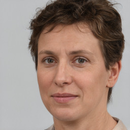 Joyful white adult female with short  brown hair and brown eyes