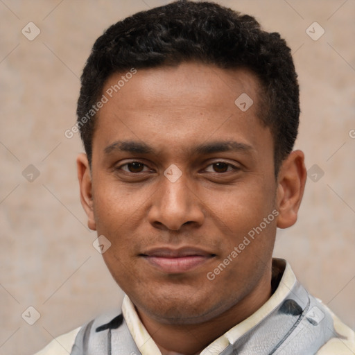 Joyful latino young-adult male with short  brown hair and brown eyes