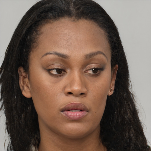 Neutral black young-adult female with long  brown hair and brown eyes