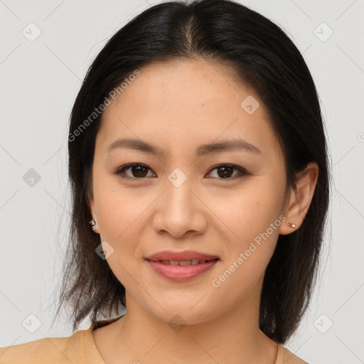 Joyful asian young-adult female with medium  brown hair and brown eyes