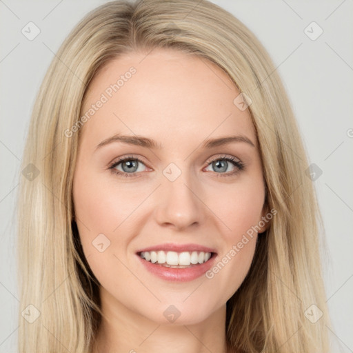 Joyful white young-adult female with long  brown hair and blue eyes