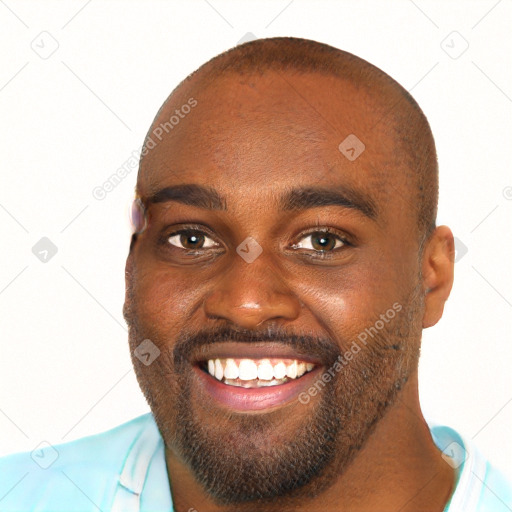 Joyful black young-adult male with short  brown hair and brown eyes