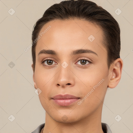 Joyful white young-adult female with short  brown hair and brown eyes