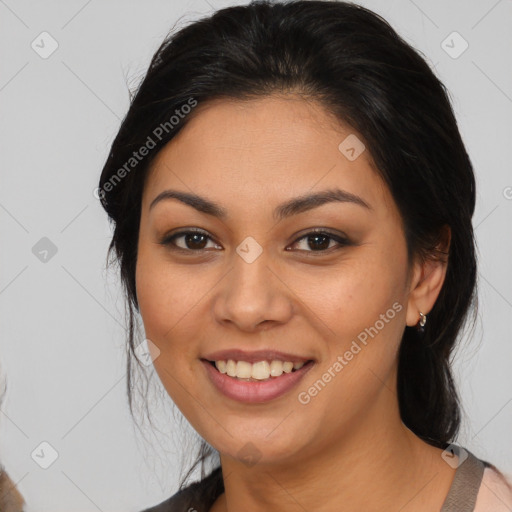 Joyful latino young-adult female with medium  brown hair and brown eyes