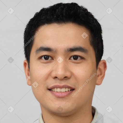 Joyful asian young-adult male with short  black hair and brown eyes