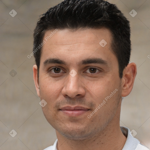 Joyful white young-adult male with short  black hair and brown eyes