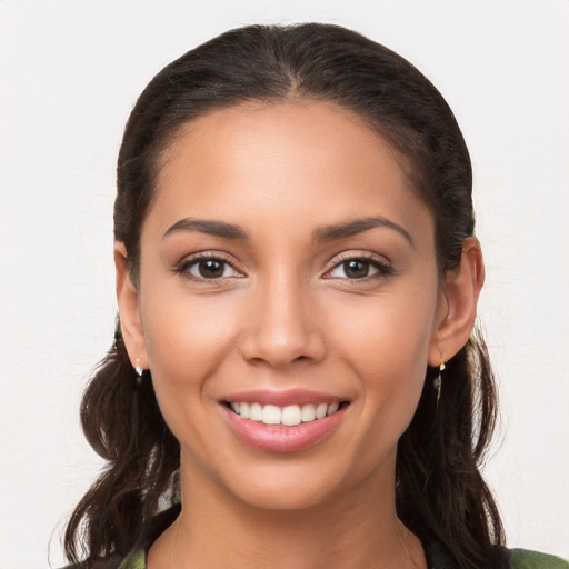 Joyful white young-adult female with long  brown hair and brown eyes