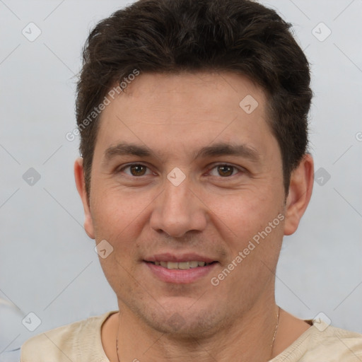 Joyful white adult male with short  brown hair and brown eyes