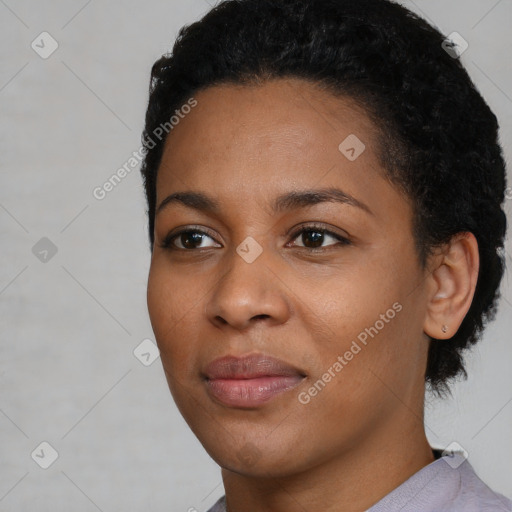 Joyful latino young-adult female with short  black hair and brown eyes