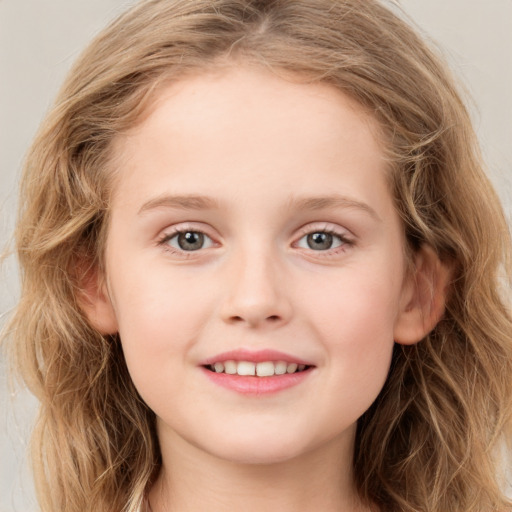 Joyful white child female with long  brown hair and blue eyes