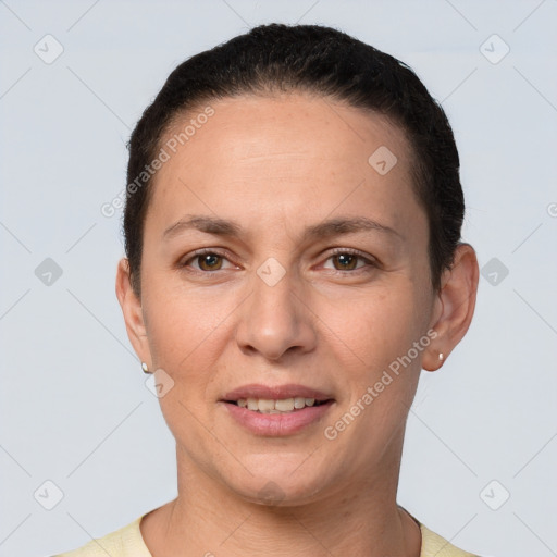 Joyful white adult female with short  brown hair and brown eyes