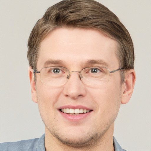 Joyful white adult male with short  brown hair and grey eyes