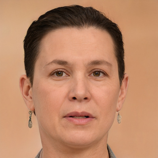 Joyful white adult female with short  brown hair and brown eyes