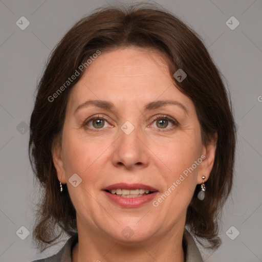 Joyful white adult female with medium  brown hair and grey eyes