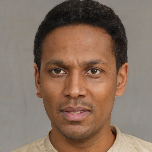 Neutral latino young-adult male with short  black hair and brown eyes