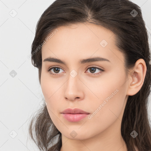 Neutral white young-adult female with long  brown hair and brown eyes