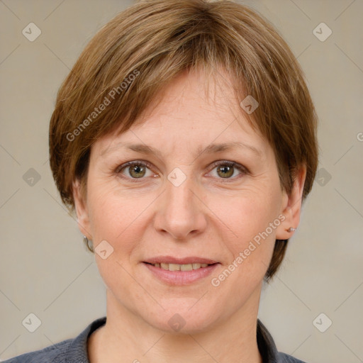 Joyful white adult female with medium  brown hair and grey eyes