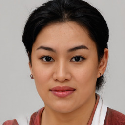 Joyful asian young-adult female with medium  brown hair and brown eyes