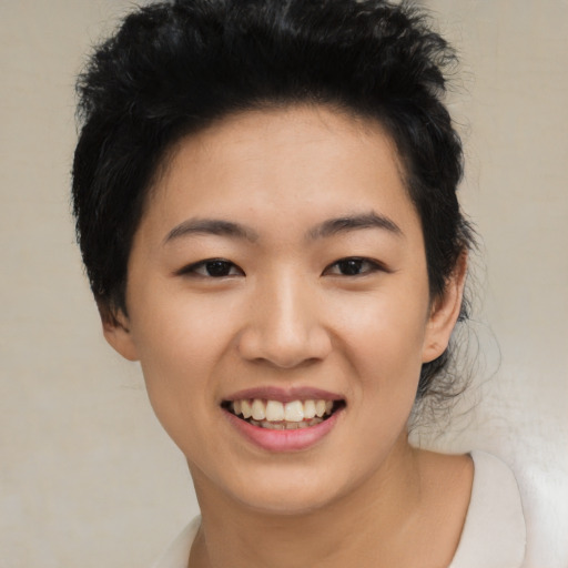 Joyful asian young-adult female with short  black hair and brown eyes