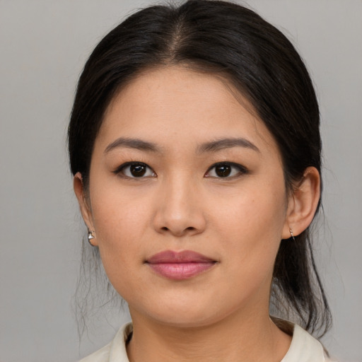 Joyful asian young-adult female with medium  brown hair and brown eyes