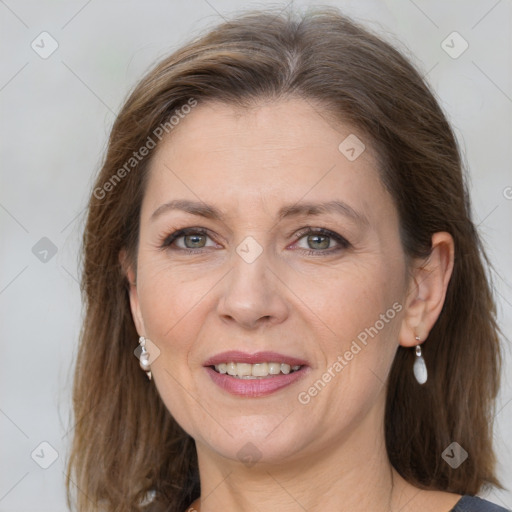 Joyful white adult female with medium  brown hair and grey eyes