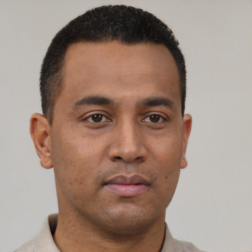 Neutral latino young-adult male with short  black hair and brown eyes