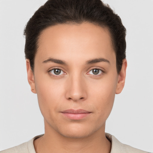 Neutral white young-adult female with short  brown hair and brown eyes