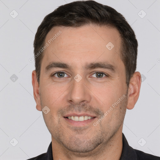 Joyful white adult male with short  brown hair and brown eyes