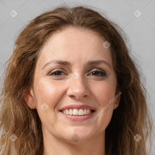 Joyful white adult female with long  brown hair and brown eyes