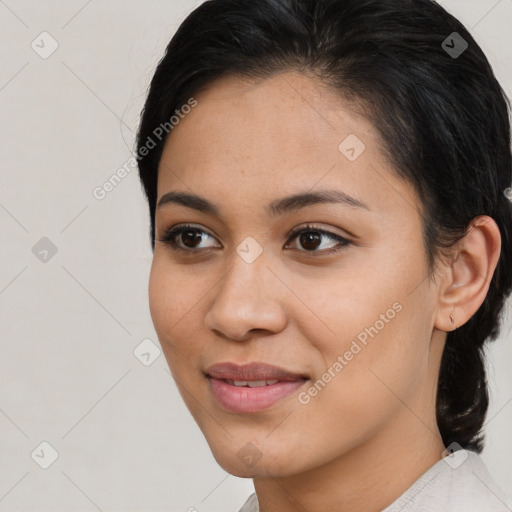 Joyful latino young-adult female with short  brown hair and brown eyes